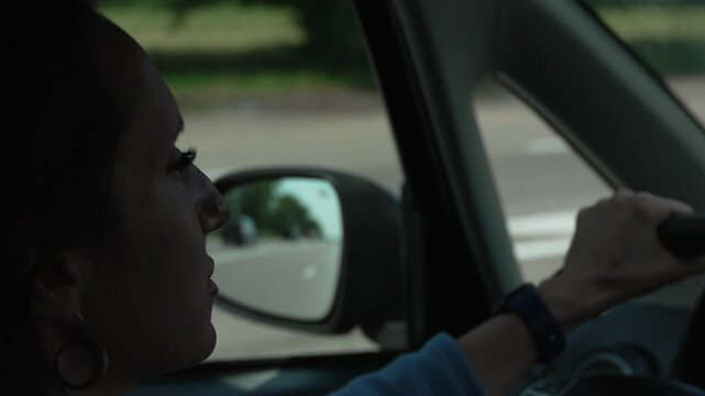 Focused Woman Driving Car Side View Road Reflection