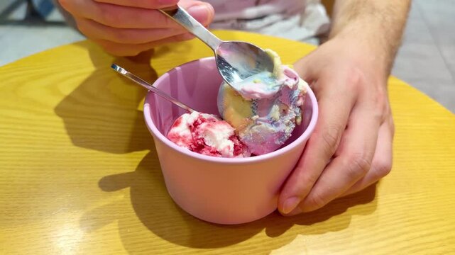Close Up of Ice Cream Scoop in Bowl with Hand Holding Spoon ,Sweet Dessert