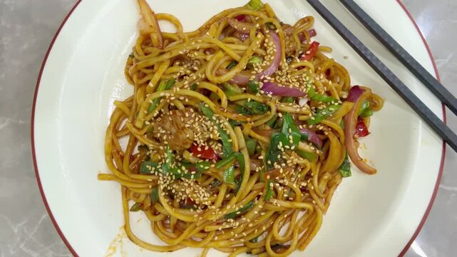 Chinese Restaurant Table with Noodles on Plate and Wonton Soup in Bowl &ndash; Traditional Dumplings and Noodle Dish