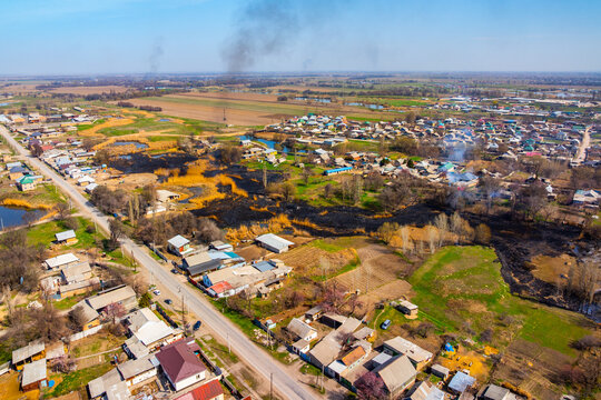 Aerial View of Rural Village in Kyrgyzstan with Fire Damage