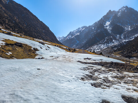 Melting Snowfield in Majestic Mountain Valley, Kyrgyzstan