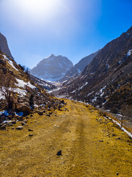 Winding Dirt Road Through Mountain Valley in Kyrgyzstan