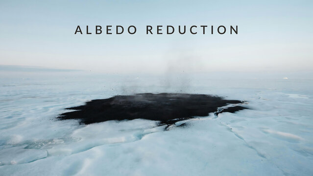 A patch of black soot or dust covering white arctic sea ice illustrating albedo reduction effects