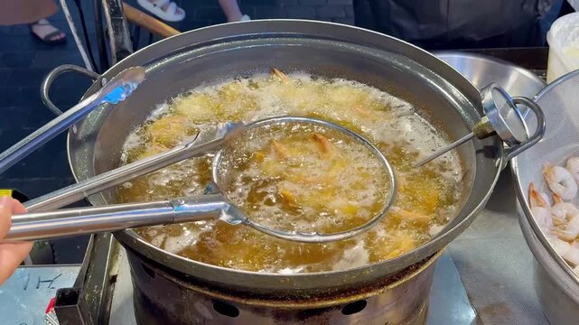 Korean Street Food &ndash; Deep Frying Fresh Shrimp in Hot Oil at Outdoor Market Stall