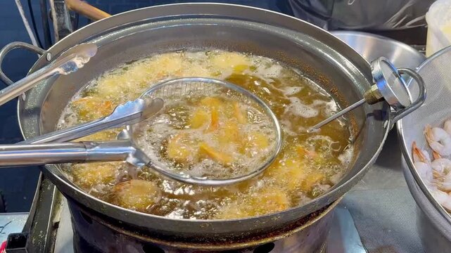 Korean Street Food &ndash; Deep Frying Fresh Shrimp in Hot Oil at Outdoor Market Stall