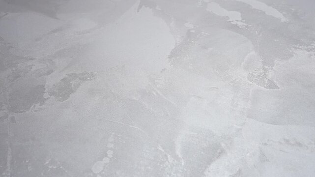 Elegant Light Grey Microcement Surface. Refined Pale Metallic Microcement For Modern Product Displays