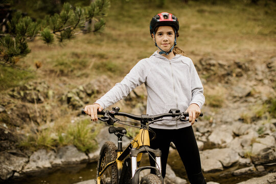 Young cyclist enjoying adventure on a rugged trail in nature