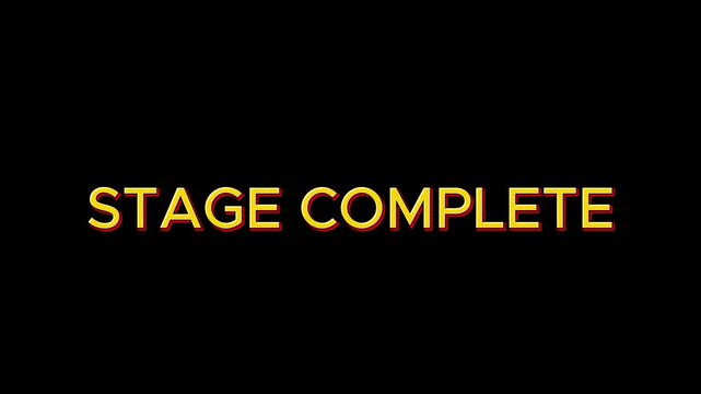 Stage Complete Victory Screen Displayed in a Classic Video Game with a Vibrant Yellow-Orange Gradient Text on a Black Background
