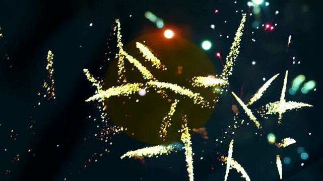 Bright golden festive fireworks display illuminating the night sky with glowing sparks and vibrant light patterns