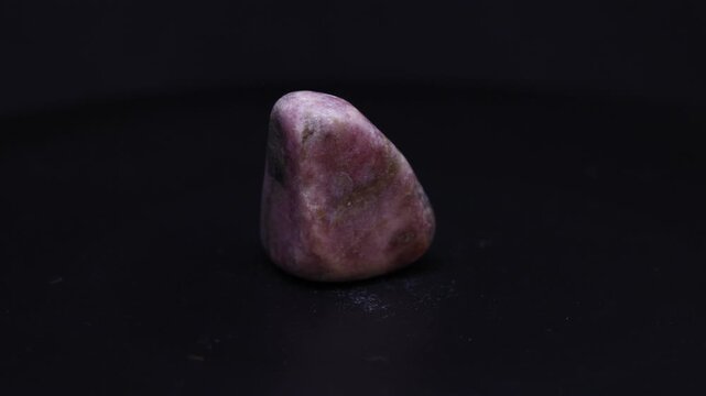 rhodonite mineral from Australia with black background
