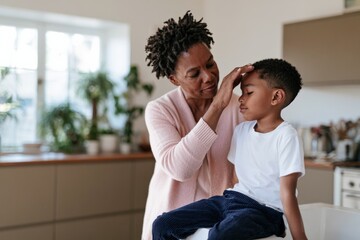 Obraz premium Woman checking a child forehead for fever at home comforting scene for healthcare background and family wellness banner design