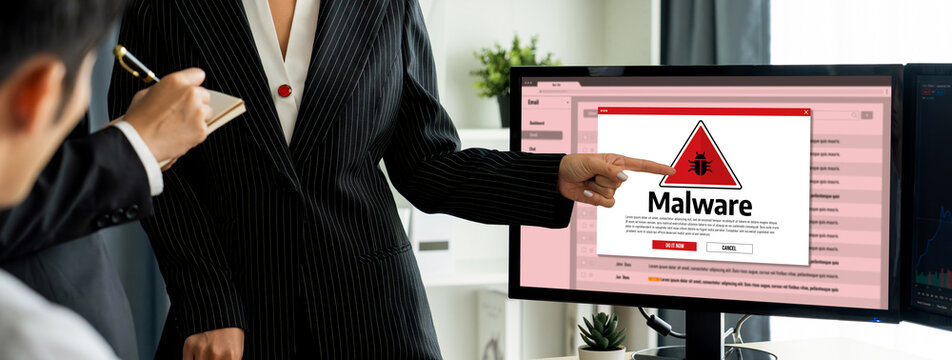 Cyber attacking concept. Malware alert showing on computer screen display scam and threat detection on computer system or online server to be removed brisk.