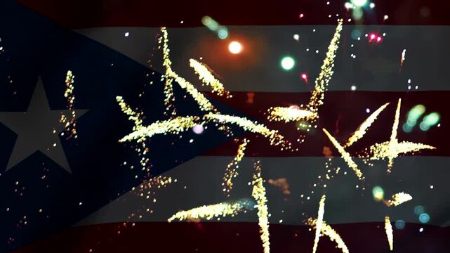 Bright golden fireworks display overlaying the national flag of puerto rico celebrating national independence day
