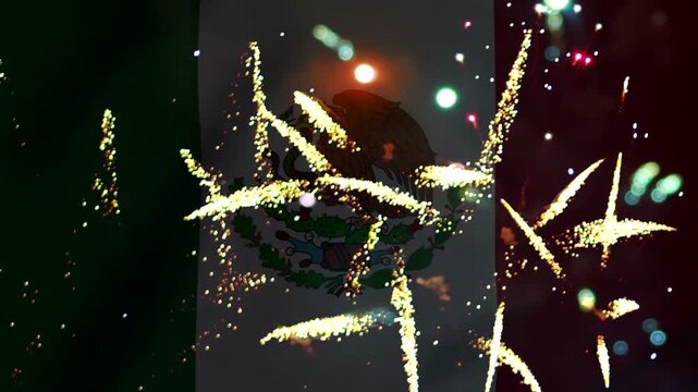Bright golden fireworks exploding in front of the waving flag of Mexico