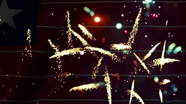 Bright golden fireworks exploding in the night sky over the national flag of Liberia