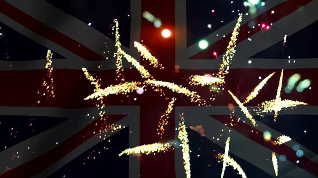 Bright golden fireworks exploding over the flag of the united kingdom
