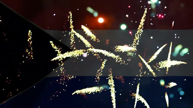 Bright golden fireworks exploding over the national flag of south sudan during a celebratory event