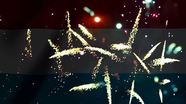 Bright golden fireworks exploding over the national flag of the yemen