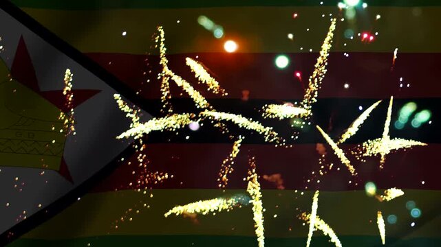 Bright golden fireworks exploding over the national flag of zimbabwe during an independence day celebration