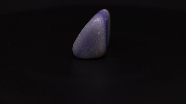 polished blue quartz from Madagascar with black background