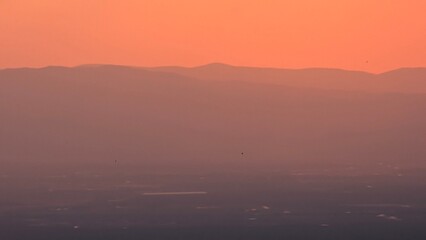 Fototapeta premium Sunset and a warm orange sky and a natural landscape