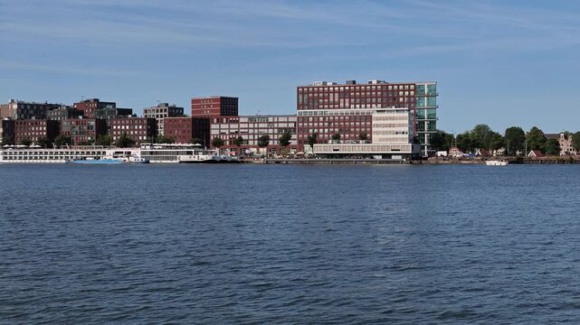 Netherlands - 23 august 2026, Amsterdam: Panorama View Over IJ River Waterfront Pan Left