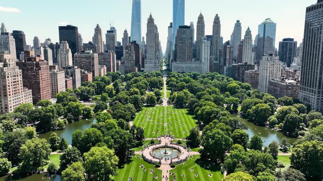Manhattan cityscape with Central Park in lush green during daylight with skyscrapers in background