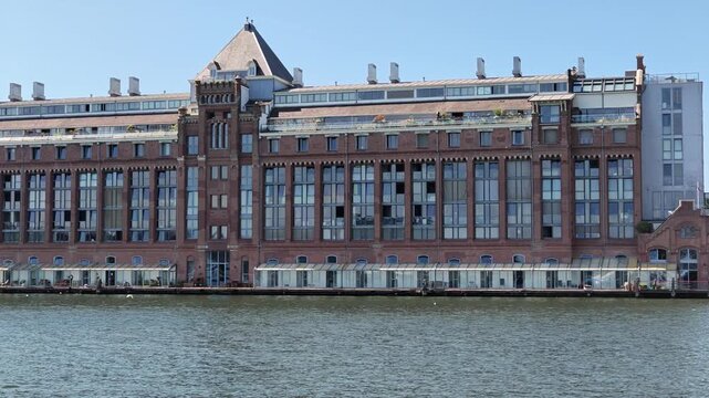 Netherlands - 23 august 2026, Amsterdam: Old Industrial Factory Heritage Site Along IJ Dolly Left