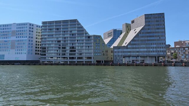 Netherlands - 23 august 2026, Amsterdam: Apartment Buildings on IJ Waterfront Dolly Left