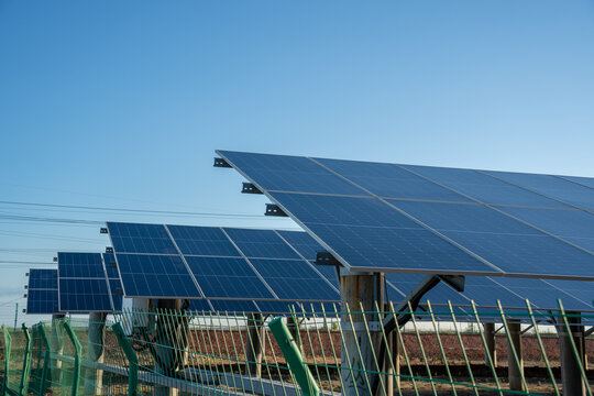 Solar Panel Array Under Clear Blue Sky