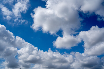 Fototapeta premium Bright Blue Sky Fluffy White Clouds On A Sunny Day