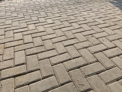 Herringbone Pattern Concrete Paver Blocks for Outdoor Pavement and Driveway Background
