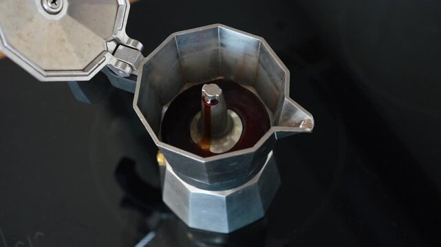 Close-up of coffee brewing in moka pot