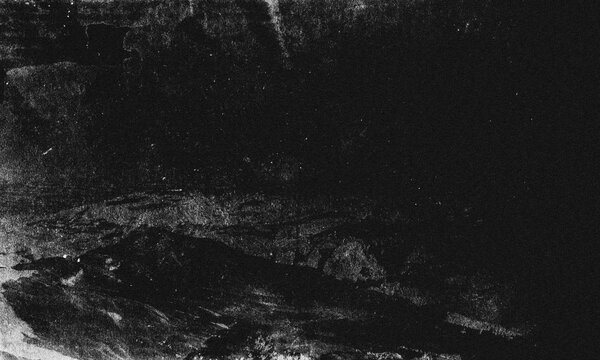 Close-up texture of dark cracked earth with dry soil and natural weathering patterns