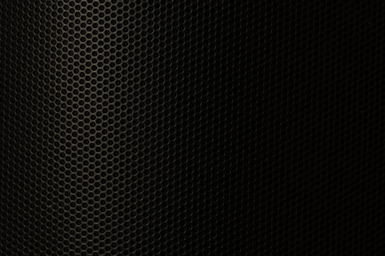 Dark Metallic Speaker Grille Texture Background,Macro,Close up of a dark black metallic speaker grille background with a seamless circular hole pattern texture, ideal for industrial, audio, and techno