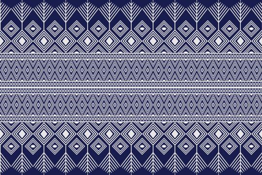 Seamless traditional indigo tribal textile pattern with symmetrical geometric diamond and chevron motifs.