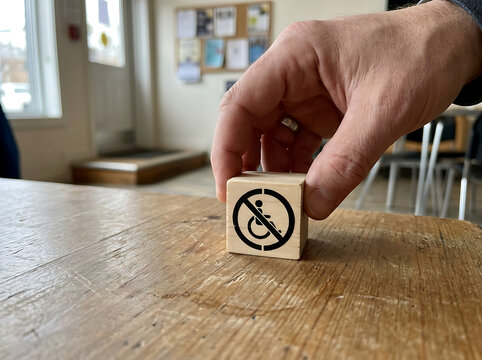 Hand holding wooden block with no icon