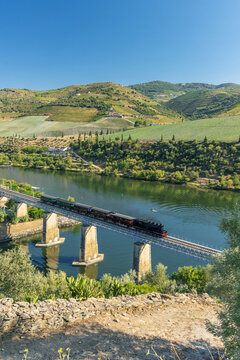 Steam train on railway bridge (Ponte Ferroviaria do Tua), Tua, Alto Douro, Portugal