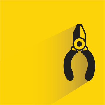 pliers icon with shadow on yellow background