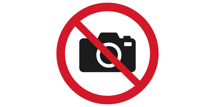 No photography allowed sign with black camera icon on red circle border.