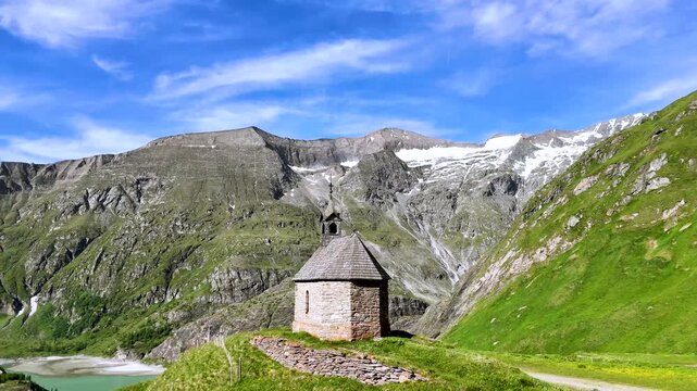 Alpine Chapel Below Grossglockner Mountains in Austria, Drone View
