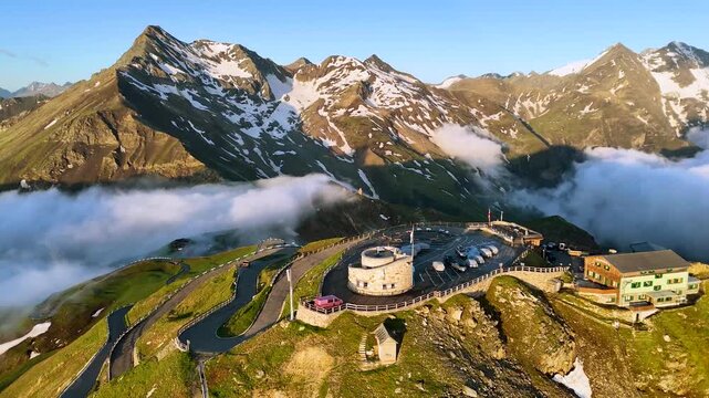 Forward Drone Flight Toward Edelweissspitze on Grossglockner Alpine Road at Sunrise
