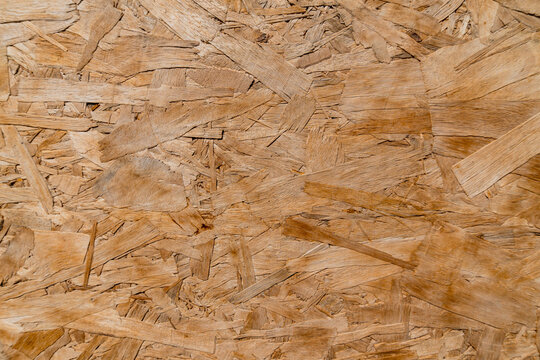 OSB Board Texture Background, Close-up Natural Wood Flake Chipboard Sheet