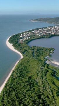 Florian&oacute;polis, Daniela Beach. Aerial View of Tropical Coastline. Establishing Shot. Santa Catarina, Brazil. Vertical video