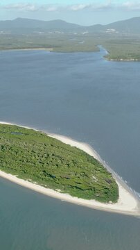 Florian&oacute;polis, Daniela Beach. Aerial View of Tropical Coastline. Establishing Shot. Santa Catarina, Brazil. Vertical video