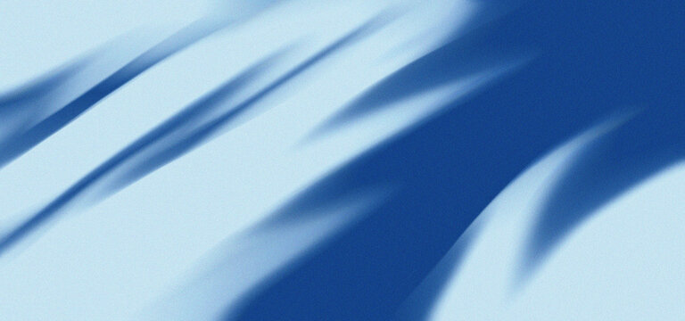 Abstract flowing blue fabric texture with soft gradients and dynamic motion blur effect