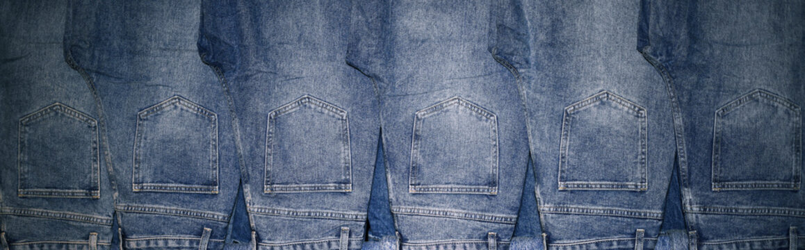 Row of Blue Denim Jeans Hanging in Retail Store