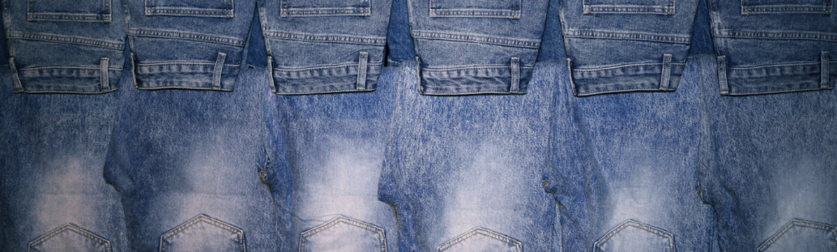Row of Blue Denim Jeans Hanging in Retail Store