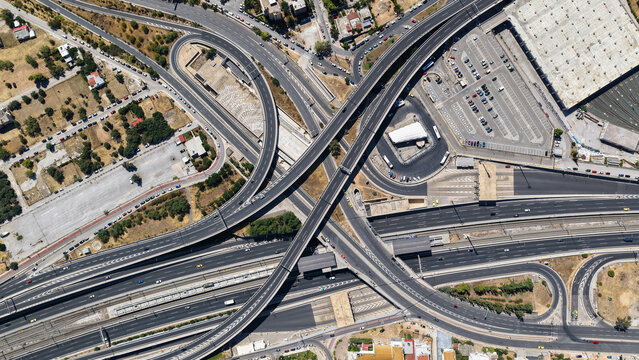 Aerial drone photo of urban multilevel highway junction road using multiple bridges forming a spaggheti road with light traffic