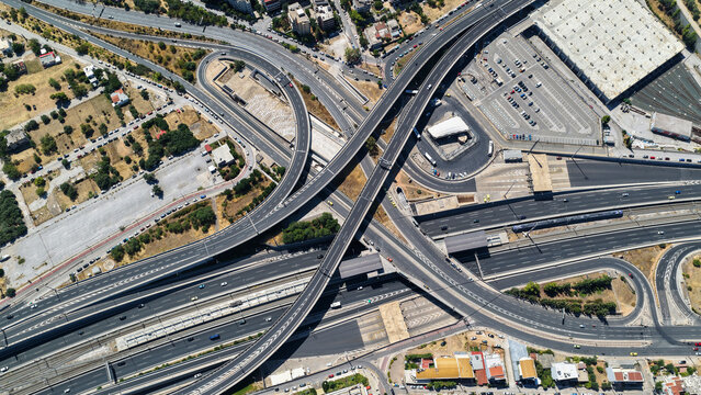 Aerial drone photo of popular multilevel highway junction overpass of Attiki Odos road, passing through Doukisis Plakentias Avenue with light traffic, Athens, Attica, Greece